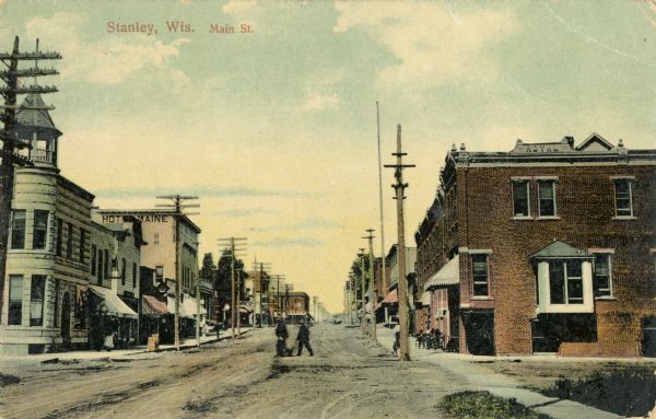 View down center of Main Street. Caption reads: "Stanley, Wis. Main St."