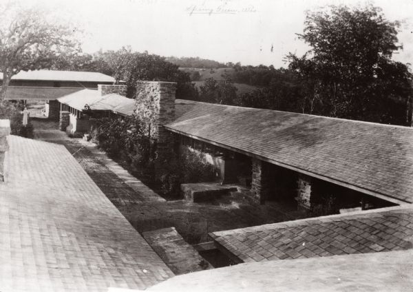 Elevated view of Taliesin, Frank Lloyd Wright's residence and studio as it appeared early 1912 before the hexagonal clerestory window was added adjacent to the studio fireplace in the fall of 1912 or the spring of 1913.