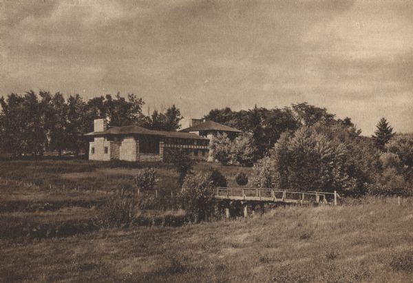 Exterior view of Hillside Home School with a bridge in the foreground.
