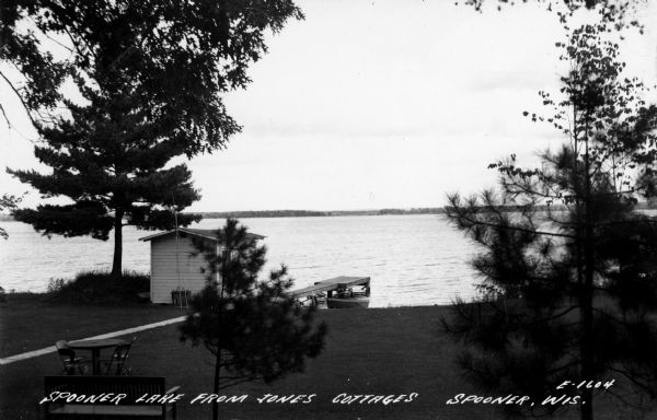 View of Spooner Lake from Jones Cottages. Caption reads: "Spooner Lake from Jones Cottages Spooner, Wis."