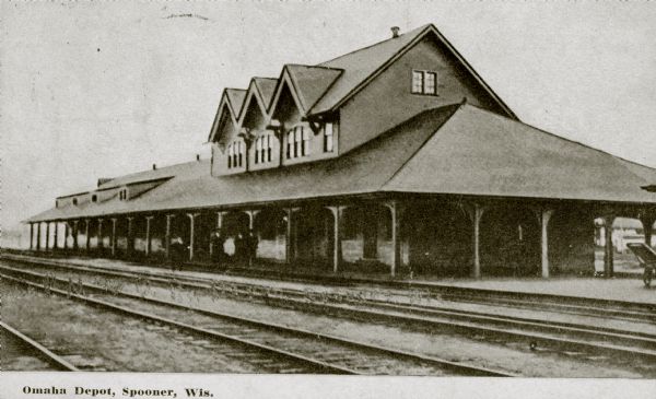 Exterior view of the Omaha Depot. Caption reads: "Omaha Depot, Spooner, Wis."
