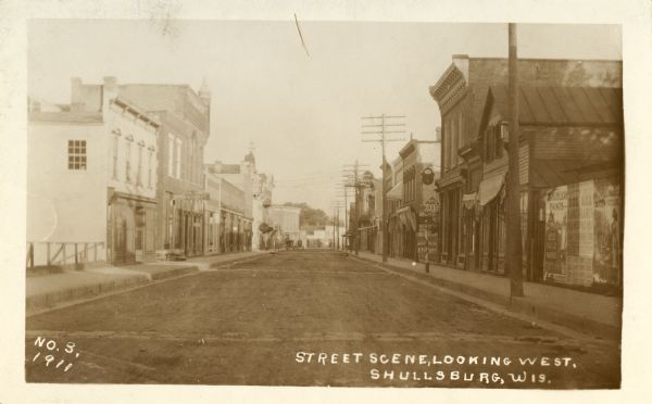 View of Water Street, looking west from the corner of Judgement Street. Caption reads: "Street Scene, Looking West, Shullsburg, Wis."