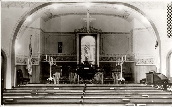 Interior view towards the altar of a Methodist-Episcopal church.