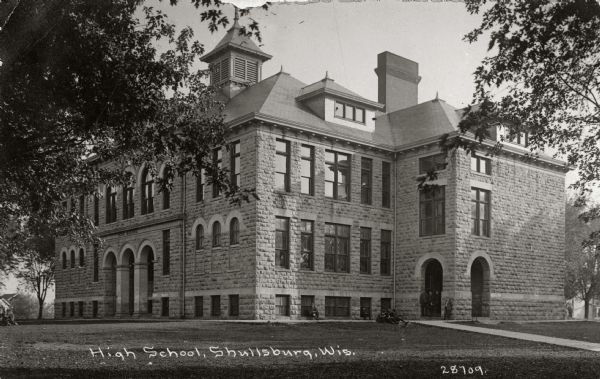 Exterior view of a high school. Caption reads: "High School, Shullsburg, Wis."