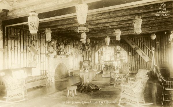 Interior view of the living room in the Buck Inn at Lost Lake Resort. Caption reads: "In The Living Room t Lost Lake Resort".