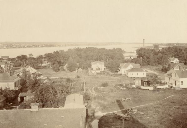 Elevated view of Sturgeon Bay with multiple buildings in the foreground.