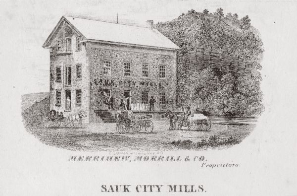 Exterior view of a mill, with several figures and horse-drawn vehicles located around it. Caption reads: "Sauk City Mills."
