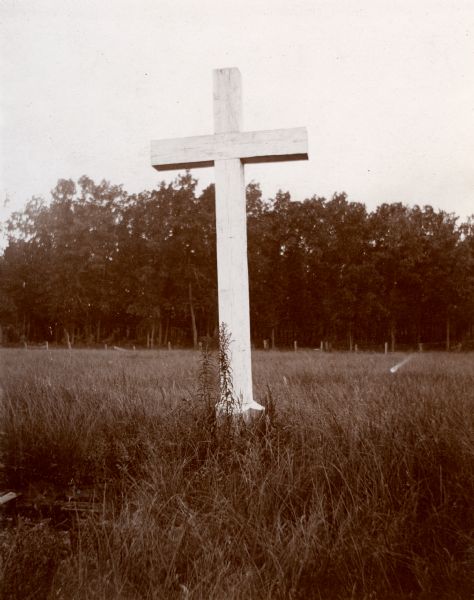 Cross in a field marking the area of "Marquette's well."