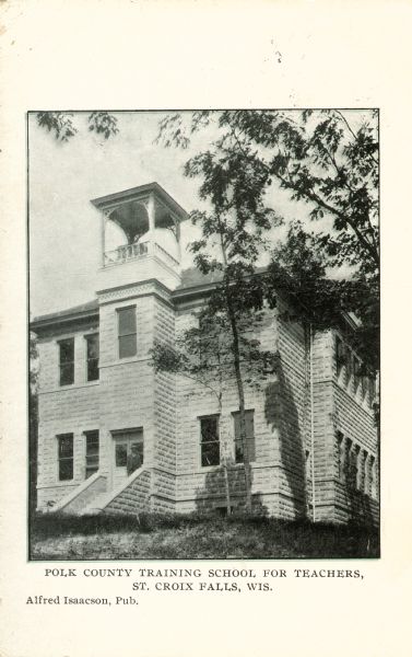 Exterior view of building with a bell tower. Caption reads: "Polk County Training School for Teachers, St. Croix Falls, Wis."