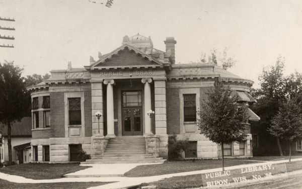 Exterior view of the Ripon Public Library. Caption reads: "Public LIbrary, Ripon, Wis."