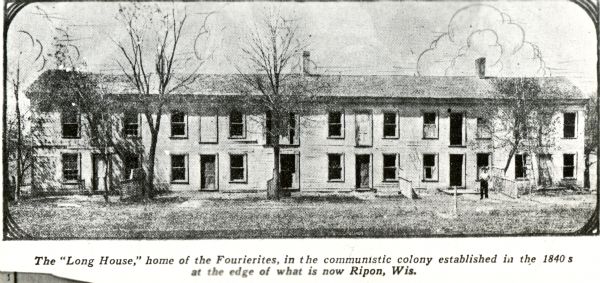 View of "Long House," one of the buildings in the experimental communal colony of the Fourierites. Caption reads: "The 'Long House,' home of the Fourierites, in the communistic colony established in the 1840s at the edge of what is now Ripon, Wis."