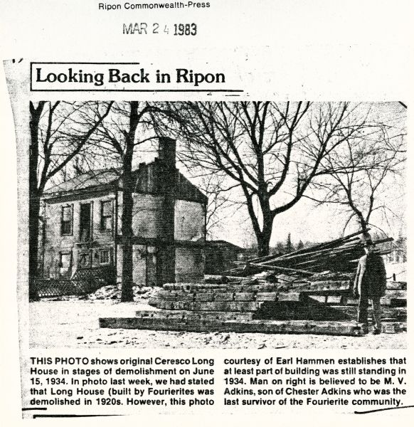 Newspaper clipping showing the demolishing of the Long House. The man on the right is believed to be M.V. Adkins, son of Chester Adkins, the last survivor of the Fourierite community.