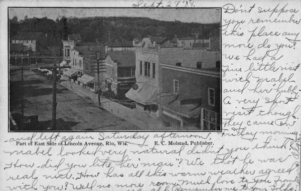 Elevated view of the east side of Lincoln Avenue. Hills are in the background. Caption reads: "Part of East Side of Lincoln Avenue, Rio, Wis."