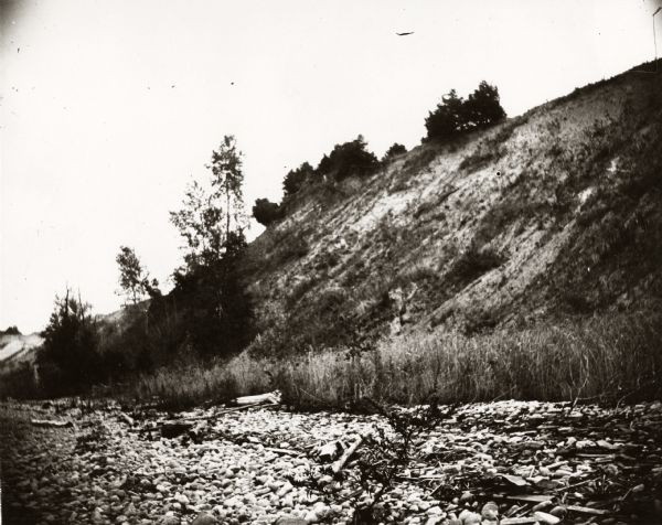 View of the shoreline, with a steep embankment.