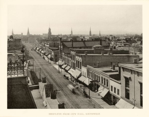 Elevated view from city hall of commercial street in downtown area. Caption reads: "Bird's-eye form City Hall, Southwest".