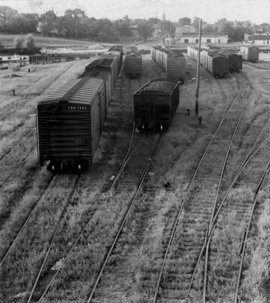 Elevated view of train cars in a railway yard.
