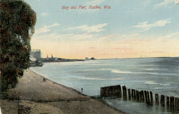 View of the main pier and harbor lighthouse from the Lake Michigan shoreline. Caption reads: "Bay and Pier, Racine, Wis."