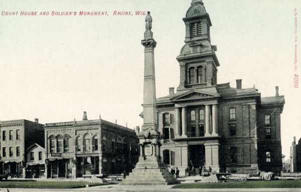 View of the monument with the courthouse behind. Caption reads: "Court House and Soldier's Monument, Racine, Wis."