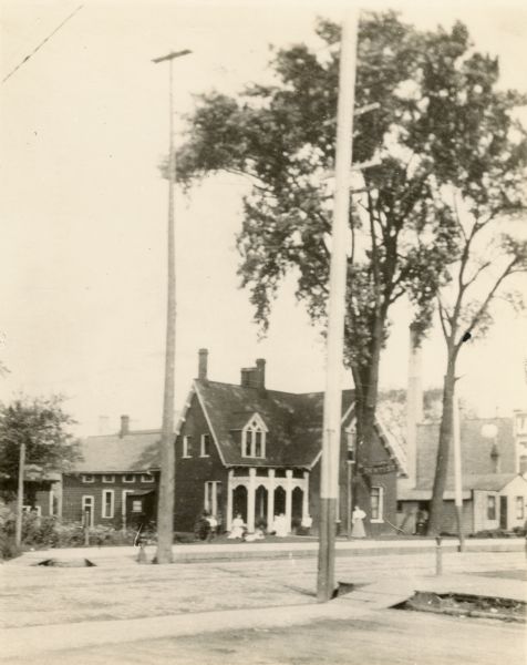 The Bradley house, the old home of Lucas Bradley, 512 Sixth Street, north side of Sixth Street, between Park and Villa. The little house at the right is the home of Peter C. Wadmond.