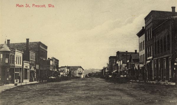 View down center of Main Street. Caption reads: "Main St., Prescott, Wis."