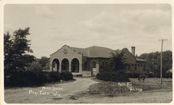 Home Store, Prairie Farm, Wisconsin. Shows right side facing front of building. Caption reads: "Home Store, Pra. Farm, Wis."