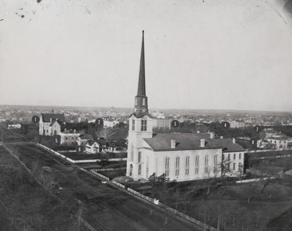 Elevated view of the First Congregational Church. Behind the church are buildings in the downtown area.