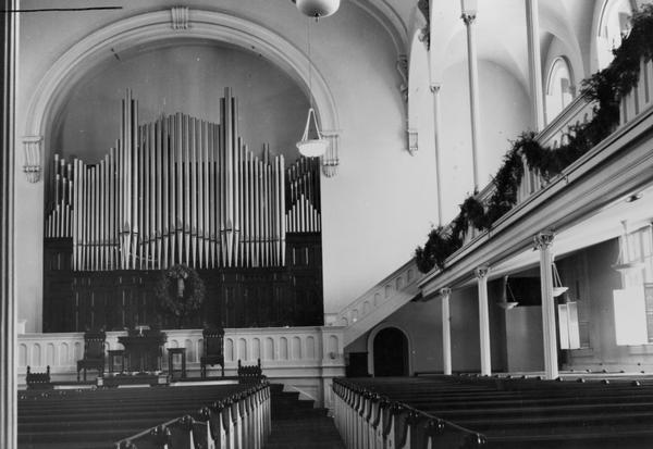 Interior of Beloit First Congregational Church. View from aisle towards the organ and altar.