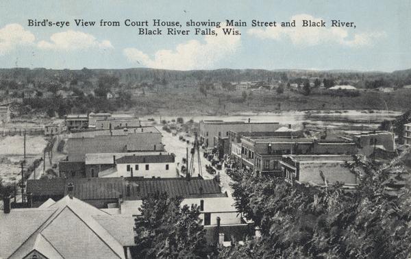 Elevated view from the Court House. Hills are in the distance. Caption reads: "Bird's-eye View from Court House, showing Main Street and Black River, Black River Falls, Wis."