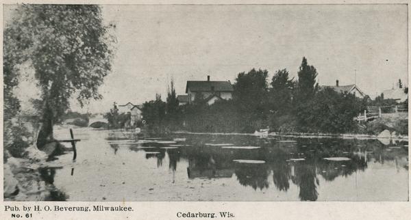 View of Cedarburg across water. Caption reads: "Cedarburg, Wis."