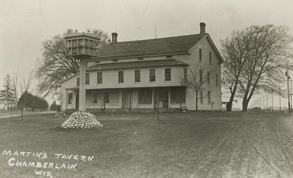 Front view of Martin's Tavern and Store in Chamberlain, with large Martin house in fromt.
