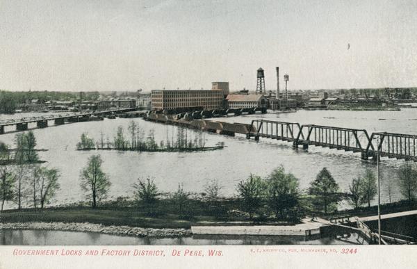 Elevated view of government locks and factory district on the Fox River. Caption reads: "Government Locks and Factory District, De Pere, Wis."