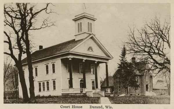 Durand courthouse, with a brick house on the right. Caption reads: "Court House, Durand, Wis."