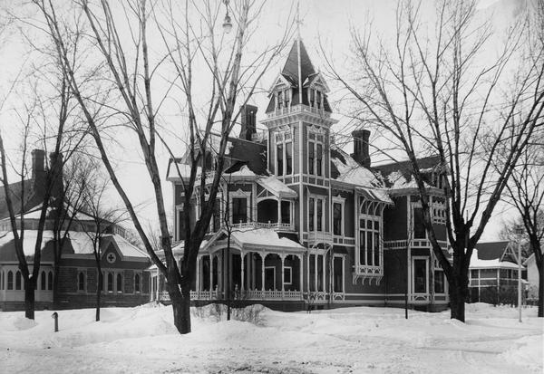 Exterior of the Ingram residence in winter, home of the wealthy lumberman O.H. Ingram.