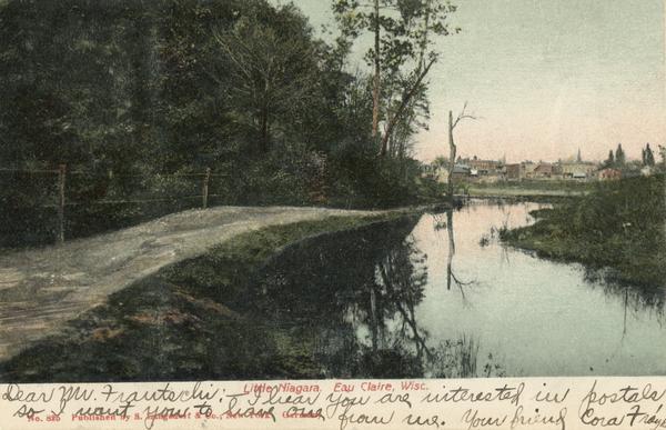 Little Niagara River, with multiple buildings in the background. Caption reads: "Little Niagara, Eau Claire, Wisc."