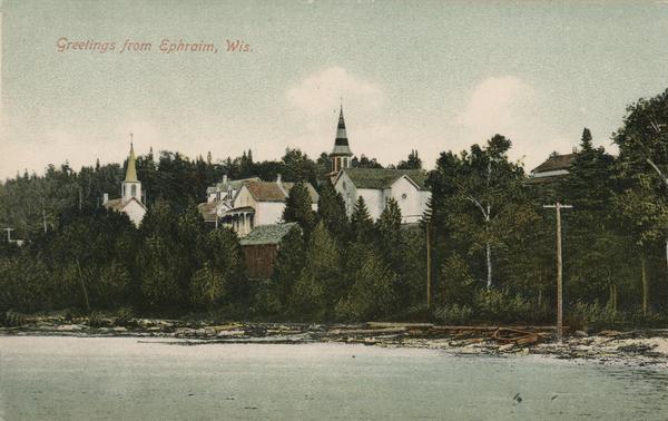 View from water of beach and buildings in Ephraim. Caption reads: "Greetings from Ephraim, Wis."