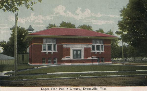 View from street towards the library. Caption reads: "Eager Free Public Library, Evansville, Wis."