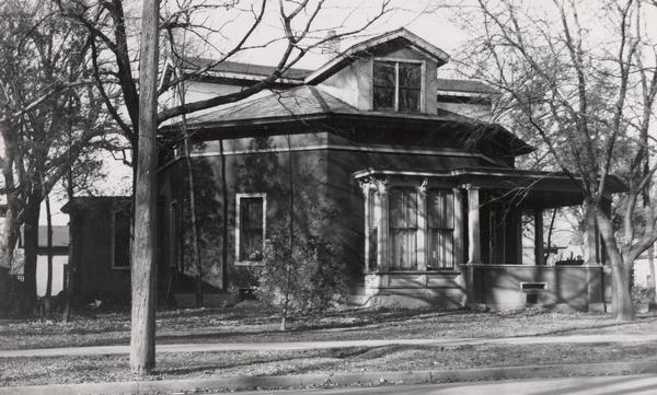Exterior view from street of the Octagon house, with trees in the yard.