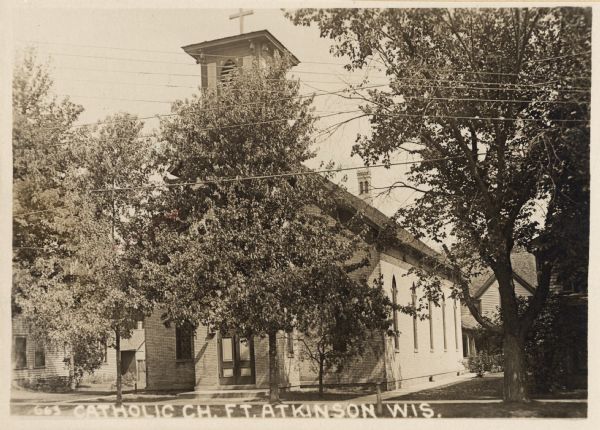 Exterior view of a catholic church. Caption reads: "Catholic Ch. Ft. Atkinson Wis."