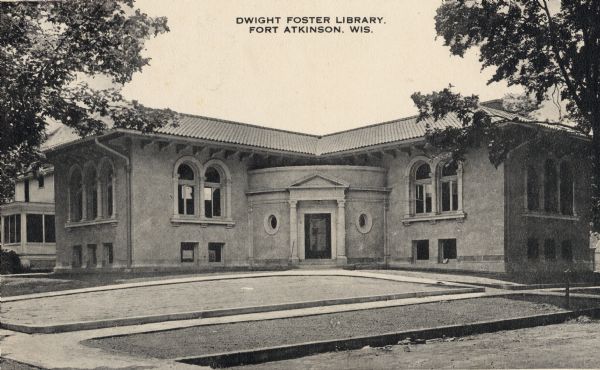 View of the front entrance to the Dwight Foster Library. Caption reads: "Dwight Foster Library, Fort Atkinson, Wis."