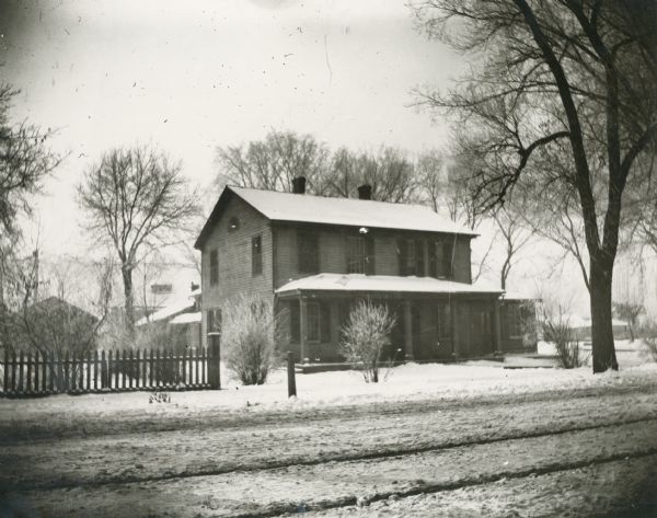 Winter view across road towards the Baker house, the residence of James S. Baker.