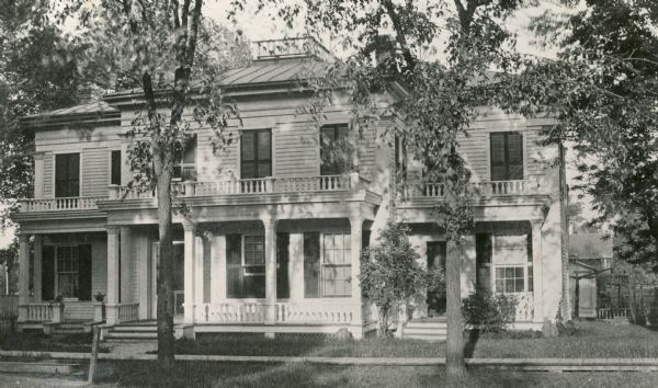 View of the Israel Greene Beaumont house. The house was located at 203 South Jefferson Street at its intersection with Doty Street. Beaumont, its resident, founded the city's Beaumont Hotel and was involved in other activities. He was the son of Dr. William Beaumont, a distinguished frontier surgeon. Reported to be one of the oldest structures in Green Bay, the home was demolished in 1932.