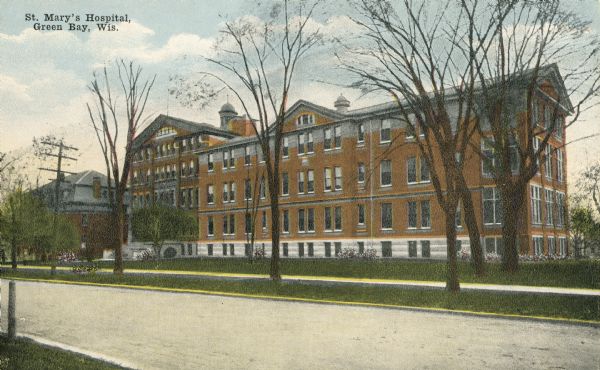 View across street toward the hospital. Caption reads: "St. Mary's Hospital, Green Bay, Wis."
