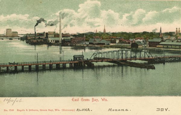 Elevated view of East Green Bay, Fox River, and various buildings belonging to the manufacturing industry. Caption reads: "East Green Bay, Wis."