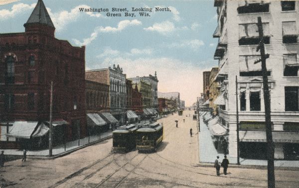 Elevated view looking north at Washington Street with cable cars. Caption reads: "Washington Street, Looking North, Green Bay, Wis."