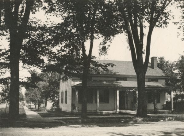 Daniel H. and Joshua Whitney's residence located at 402 Main Street at the intersection of Monroe Avenue. The house was torn down in 1897.