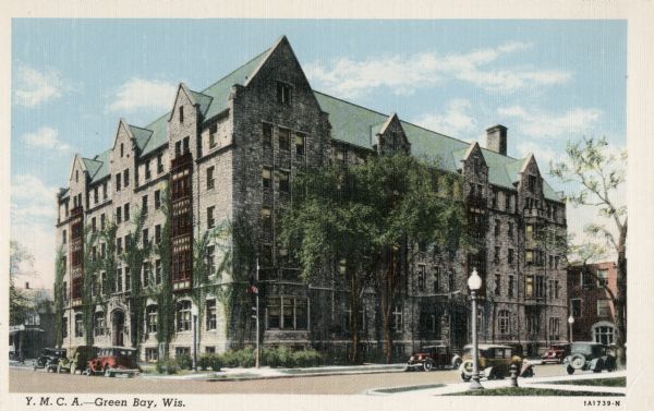 Exterior view across street toward the Young Men's Christian Association. Caption reads: "Y.M.C.A. - Green Bay, Wis."