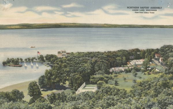 Elevated view of American Baptist Assembly Grounds from Judson Tower. Below near the tree-covered shoreline are buildings, a recreation area, and a harbor with sailboats.