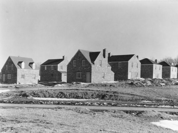 Grouping of houses in the Greendale suburb of Milwaukee, which are shown during the construction phase.
