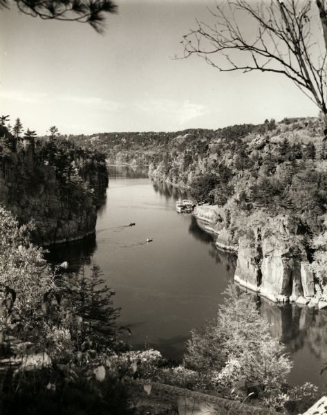 Elevated view of the Dalles on the Saint Croix River with boats docked and crossing.