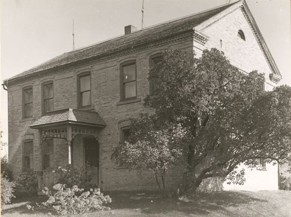 The FulWeiler house was built before the Civil War and owned by Henry FulWeiler. During the time of an Indian scare around 1862, settlers had planned to fortify themselves in this house because it was the only brick house in the vicinity. At the time the photograph was taken the house was occupied by August Fink.
